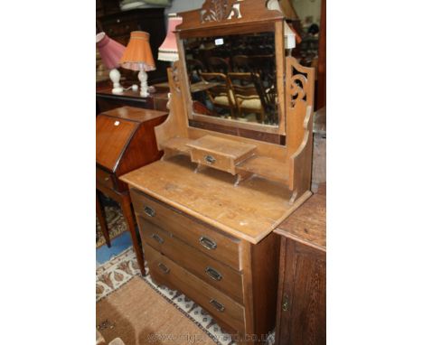 An Edwardian Oak dressing Chest having rectangular bevel plated mirror with pierced fret-cut top in pierced and fret-cut supp