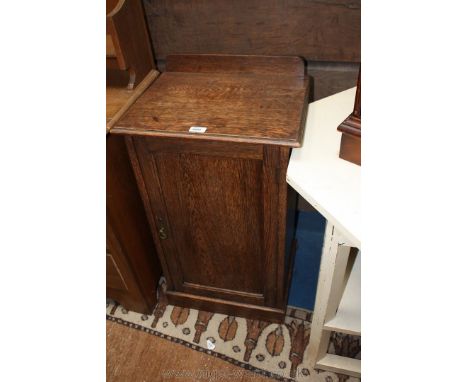 A late 19th c. Oak pot Cupboard, upstand back, bull nose moulded edge top, single panel door opening to reveal single shelf, 