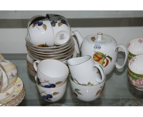 A Royal Worcester Evesham Teaset consisting six cups and saucers, six tea plates, milk jug, sugar bowl and teapot