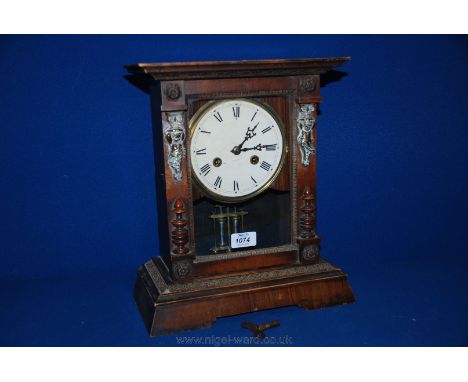 A Mahogany cased Bracket Clock, the front decorated with brass cherubs and rosettes 