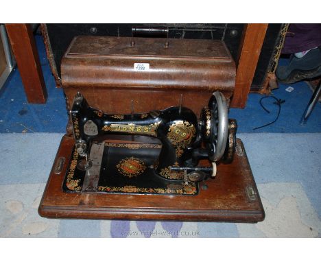 A wooden cased manual Sewing Machine by Jones
