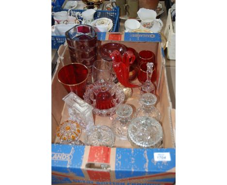 A quantity of glass including dressing table set of four lidded pots, a pair of candlesticks, clock, ring tree, etc.  