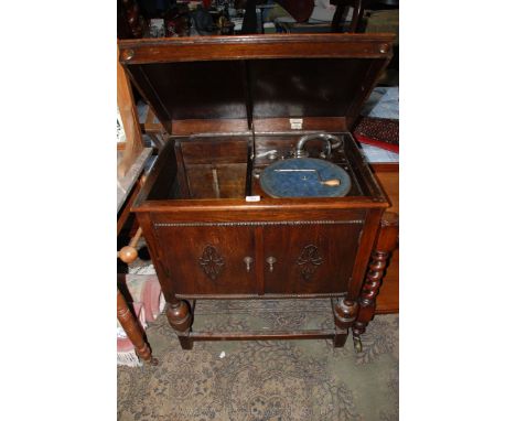 A circa 1920 Oak cased Gramophone by 'Sterna' having moulded edge lifting lid, opening to reveal deck and record compartment,