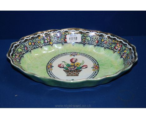 An early 20th c. New Hall Boumier ware Bowl, signed Lucian Boullemier in light green and gilt design with floral band and cen