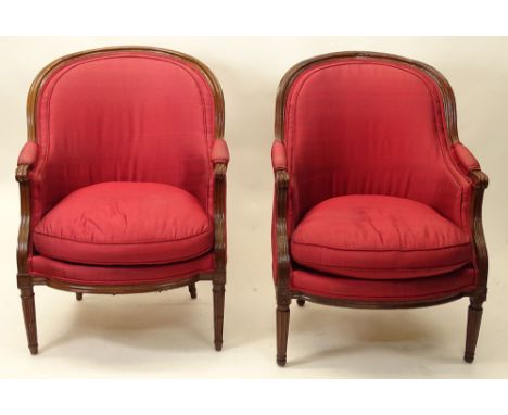 Pair of Associated 19th Century French Louis XVI style Carved Walnut Bergeres. Unsigned. Good Condition. Measure 38 Inches Ta