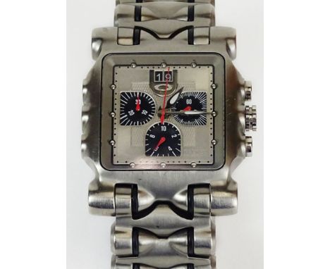 Men's Oakley Swiss made Titanium Quartz Movement Chronograph Watch. Case Measures 42-1/2mm. Bracelet Measures 7 Inches. Minor
