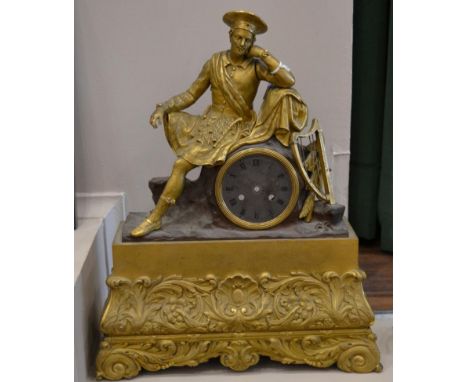 A Figural Gilt Metal Striking Mantel Clock, circa 1850, case surmounted by a gentleman leaning, base with scroll and floral d