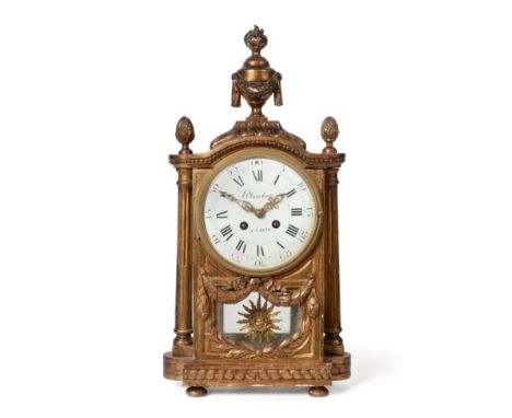 A Giltwood Striking Mantel Clock, late 19th/early 20th century, urn and acorn finials, fluted side columns, 5-1/4-inch enamel