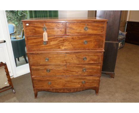 A George III Mahogany Chest on Chest, early 19th century, the upper section with two short over one long drawer, the base wit