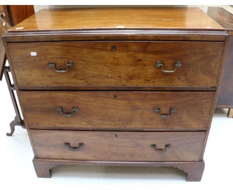 A George III Mahogany Secretaire Chest, circa 1800, with later pine top above a deep drawer with fall front enclosing pigeon 