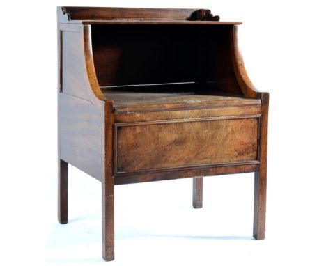 A George III Mahogany Commode, early 19th century, with three-quarter gallery above a shelf and hinged lid below enclosing a 