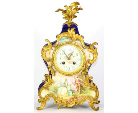 A Ceramic and Gilt Metal Mounted Striking Mantel Clock, early 20th century, ceramic case with dark blue sides and scroll gilt