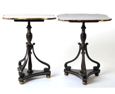 A Pair of Regency Papier Mâché, Ebonised and Parcel Gilt Tripod Tables, early 19th century, the tops decorated with acanthus 