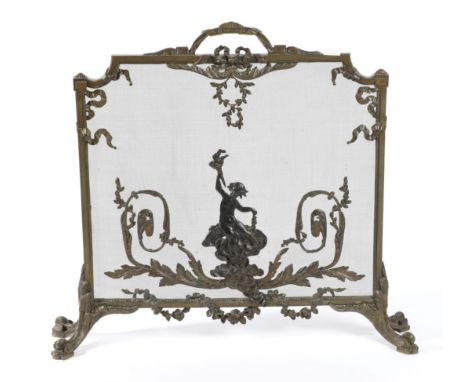 A Brass Firescreen, in Louis XV style, the mesh screen with applied decoration of acanthus leaves, scrolls and a putto, raise