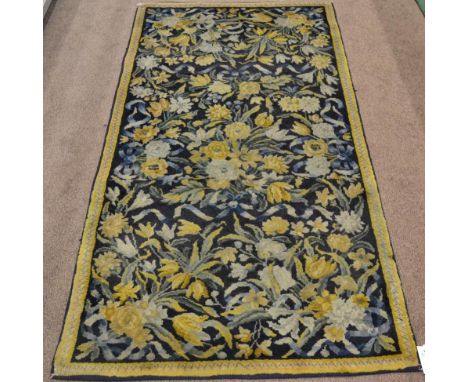 Unusual Hand-Knotted European Carpet of 17th Century Design, circa 1930 The field of naturalistic flowers enclosed by narrow 