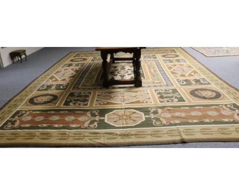 Portuguese Machine Made Carpet, late 19th/early 20th century The polychrome compartmentalised field of neo-classical motifs a