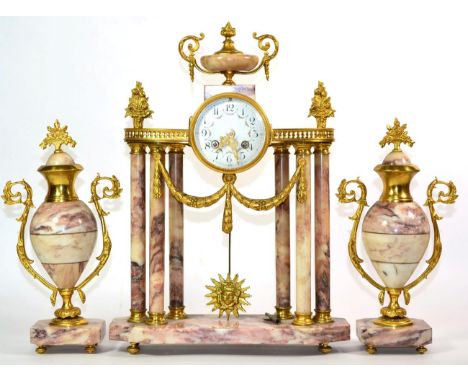 A Gilt Metal and Marble Portico Striking Mantel Clock Garniture, early 20th century, portico case surmounted with an urn fini