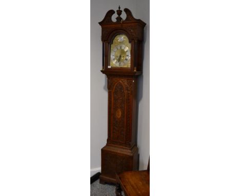 An Oak Eight Day Longcase Clock, elaborately later carved case with a swan neck pediment, 11-1/4-inch arched brass dial, matt