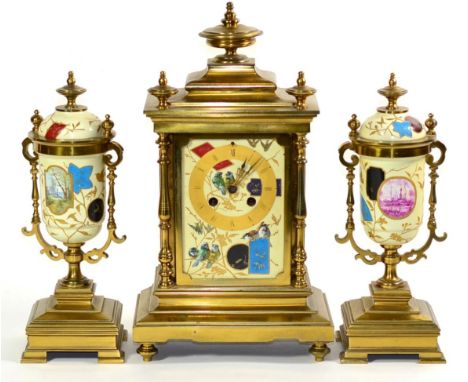 An Aesthetic Brass Ceramic Mounted Striking Mantel Clock Garniture, circa 1890, front and side ceramic panels with foliage an