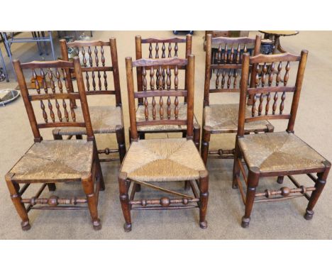 A Set of Six Mid 19th Century Ash and Elm Rush-Seated Dining Chairs, Lancashire/Cheshire region, with comb shape top rails ab