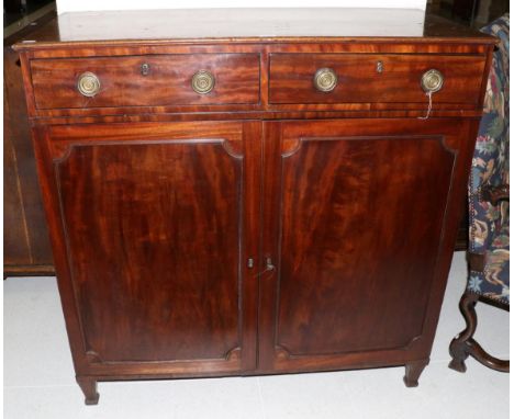 A Regency Mahogany and Ebony Strung Dwarf Linen Press, early 19th century, with two frieze drawers above cupboard doors enclo