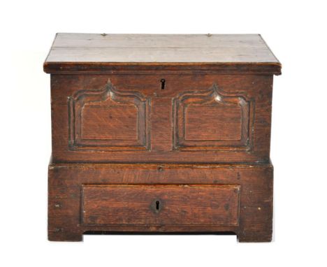 A Joined Oak Coal Box, in the form of an 18th century chest with hinged lid, with removable metal liner and two fielded panel