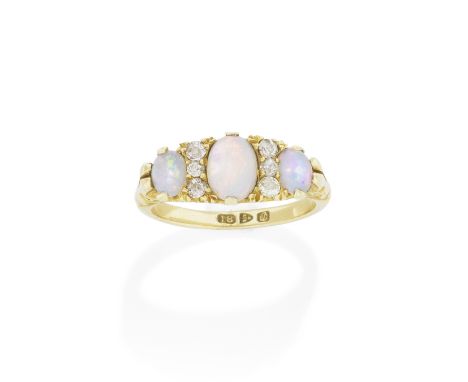 OPAL AND DIAMOND RING, CIRCA 1900Set with three opals and old brilliant and single-cut diamonds, mounted in yellow gold, part