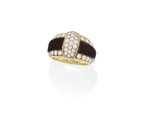 VAN CLEEF &amp; ARPELS: ONYX AND DIAMOND RINGThe centre section pavé-set with round brilliant-cut diamonds, the carved onyx s