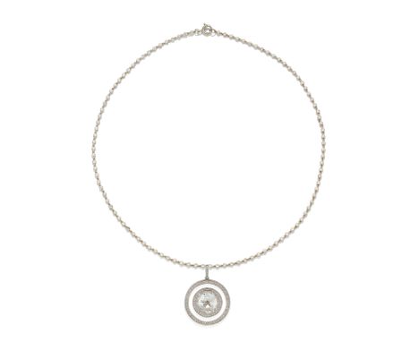 DIAMOND WATCH/PENDANT NECKLACE, CIRCA 1910The circular dial with Arabic numerals and blued steel hands, within a rock crystal
