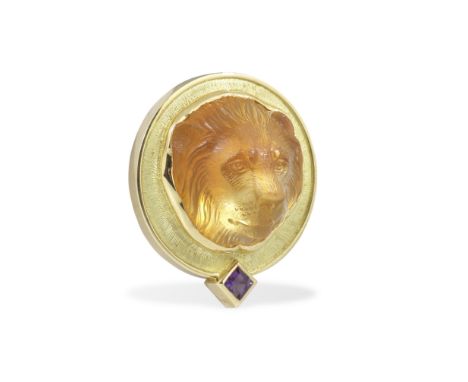 STEPHEN WEBSTER: CITRINE AND AMETHYST LION BROOCH, 1992The citrine lion's head carved in high relief, within a textured 18 ca