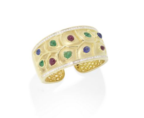 ADLER: DIAMOND AND GEM-SET CUFF BANGLESet to the front with cabochon emeralds, rubies and sapphires, within scalloped motif w