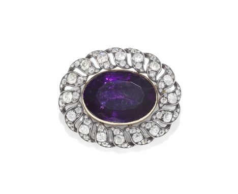 AMETHYST AND DIAMOND BROOCH,  MID 19TH CENTURYThe oval-cut amethyst, within an openwork scrolling surround of old cushion-sha