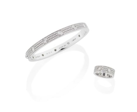 CARTIER: DIAMOND 'LOVE' BANGLE AND RINGEach 18 carat gold polished band collet-set at intervals with brilliant-cut diamond ac