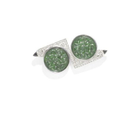 ART DECO JADE, DIAMOND AND ONYX BROOCH, CIRCA 1920Of Eastern inspiration, each jade disc carved with birds amidst blossoms an