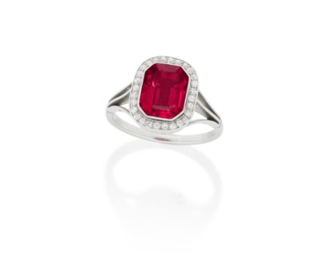 SPINEL AND DIAMOND RING, FIRST HALF OF THE 20TH CENTURYThe step-cut spinel within a surround of old single-cut diamonds, betw