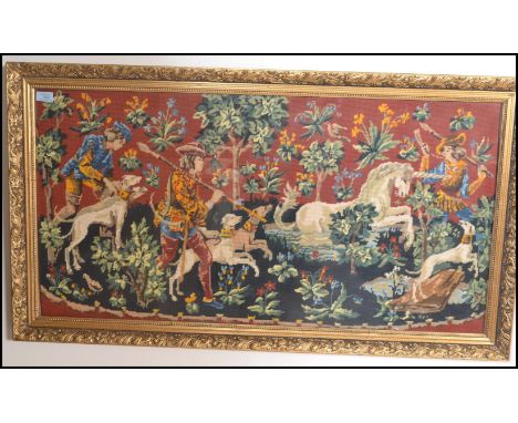 A 20th Century large French Tapestry depicting the Unicorn Hunt based on the original from the 1600's. Set to a large frame t