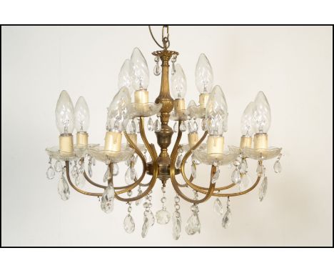 An antique style&nbsp; six branch, twelve light gilt metal and cut glass chandelier - electrolier. The sconces arranged in tw