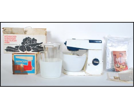 A mid century Kenwood Chef kitchen mixer complete with the K whisk along with other Kenwood accessories etc and a boxed vinta