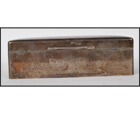 A silver hallmarked desk top cigarette case by Walker and Hall. Engined turned top to the hinged lid opening to reveal a wood