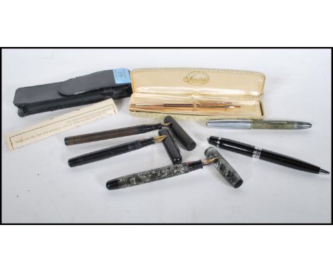 A collection of vintage writing pens to include a Parker fountain pen with a 14k gold nib, a National Security lever fill pen