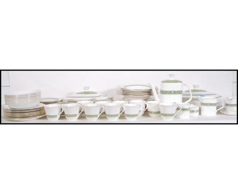 A Royal Doulton Rondelay pattern dinner / tea service comprising dinner plates, side plates, dishes, serving dishes, gravy bo