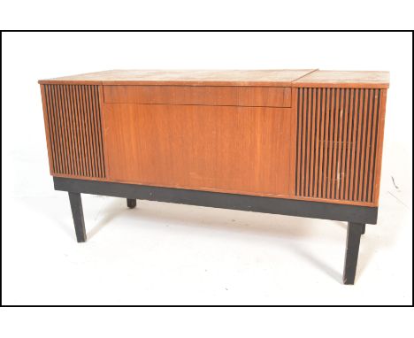 A vintage retro teak cased His Masters Voice radiogram opening to reveal a WYE electronic turntable, raised on ebonised squar