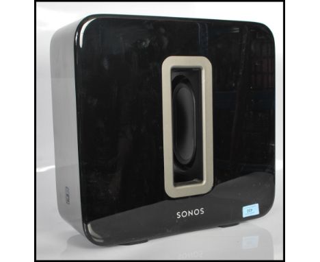 A contemporary Sonos Sub subwoofer bass speaker in black having a polished finish. Power cables not included.