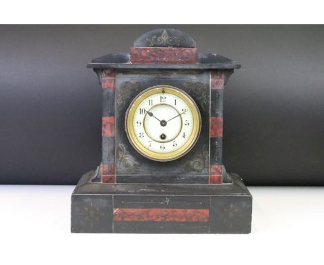 19th Century Victorian late mantle clock having a round face with arabic numerals to the chapter ring set within an architect