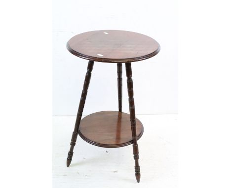 Early 20th century Mahogany Circular Wine or Lamp Table raised on three turned ringed legs united by an under-shelf, 39cm wid