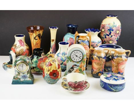 Collection of Old Tupton Ware tube lined ceramics, 19 pieces, to include vases, mantel clocks, storage jars,..., featuring an