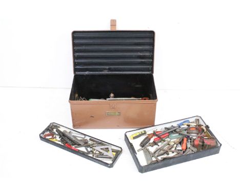 A vintage metal tool box complete with mixed tools to include vices, wrenches....etc. 