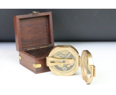 A contemporary brass cased compass within fitted wooden box. 