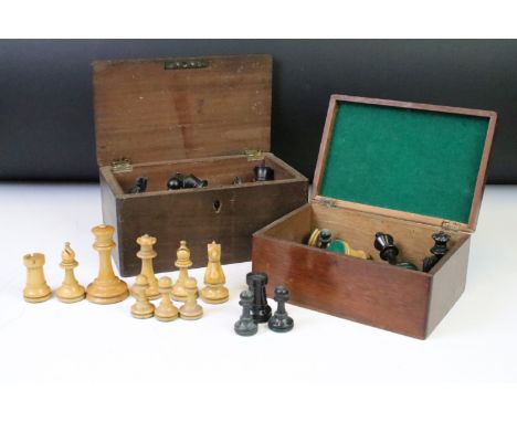 A collection of mainly early 20th century boxwood chess pieces to include Jaques examples within two wooden boxes.