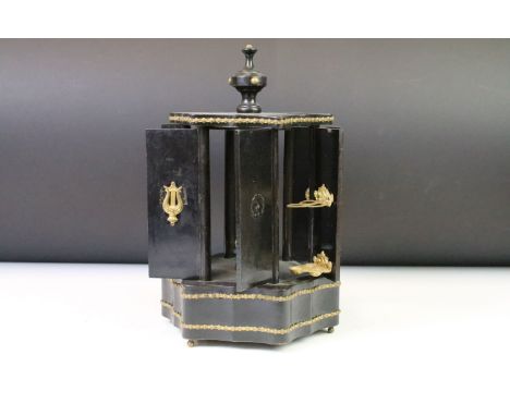 19th Century Victorian cigar dispenser constructed from ebonised wood of hexagonal form with six panel doors opening to revea